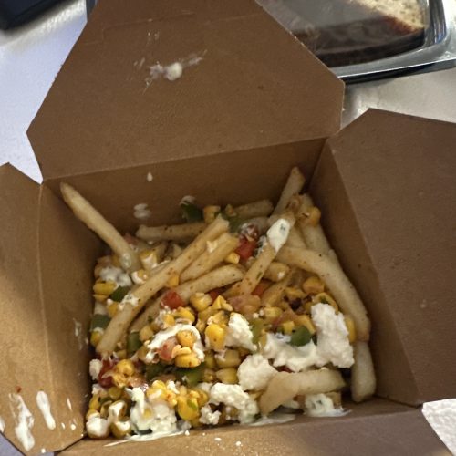 Street Corn Fries with cojita, red peppers, onion, sour cream, lime juice